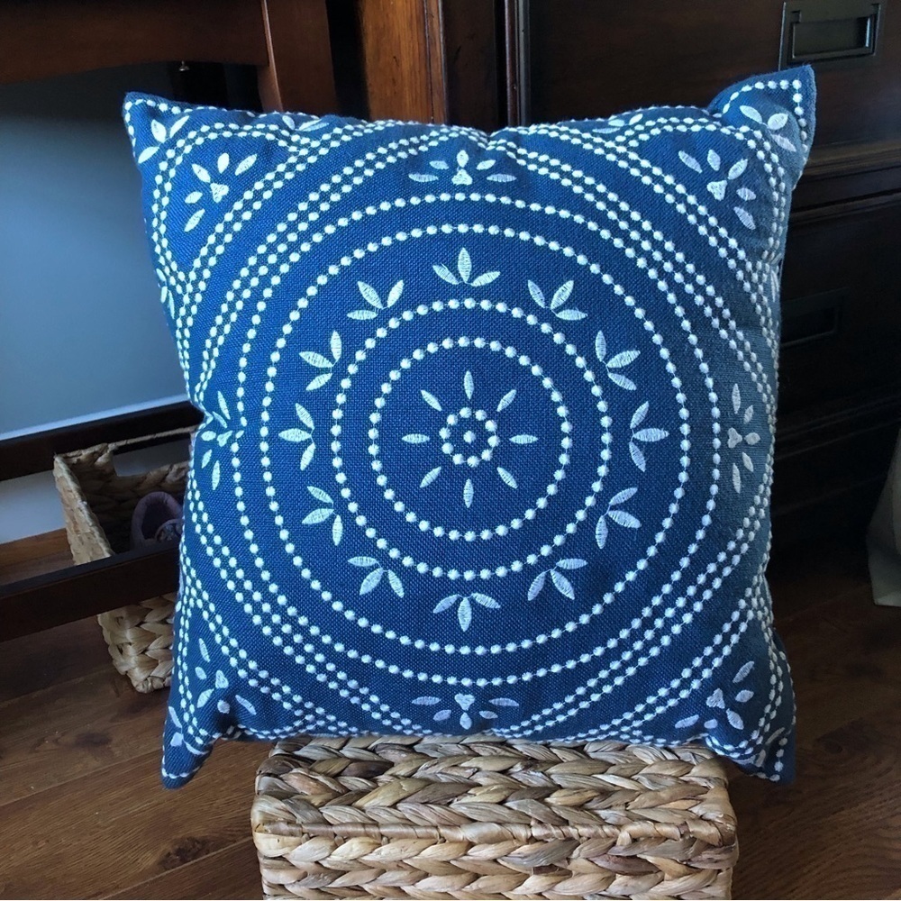 Navy and white embroidered square pillow